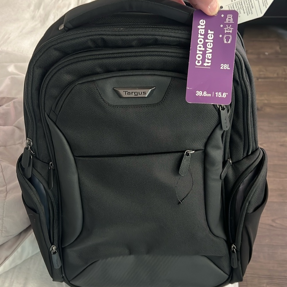 Targus corporate traveler 28L holds 15.6” laptop with safety bumpers for laptop.